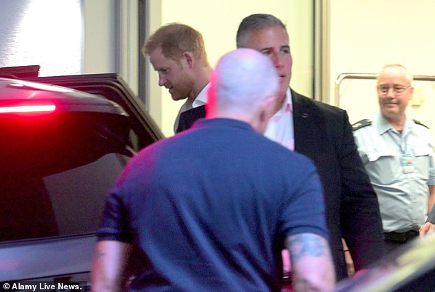 Chris Sanchez – dressed in the white shirt and black suit – accompanies Harry and Meghan on their trip to Dusseldorf for this year's Invictus Games