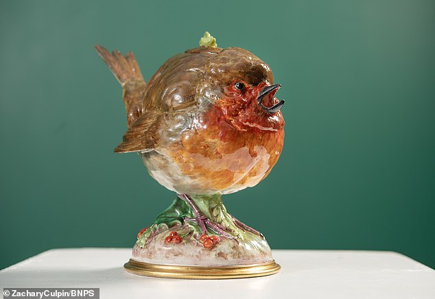 The quirky 22 cm high antique example, pictured, was made by William James Goode in 1876 from Minton porcelain