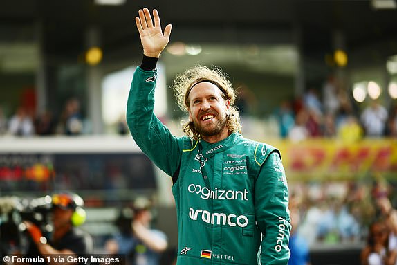 ABU DHABI, UNITED ARAB EMIRATES – NOVEMBER 20: Sebastian Vettel of Germany and Aston Martin F1 Team wave to the crowd ahead of the F1 2022 End of Year photo ahead of the F1 Abu Dhabi Grand Prix at Yas Marina Circuit on November 20, 2022 in Abu Dhabi, United Arab Emirates.  (Photo by Mario Renzi - Formula 1/Formula 1 via Getty Images)