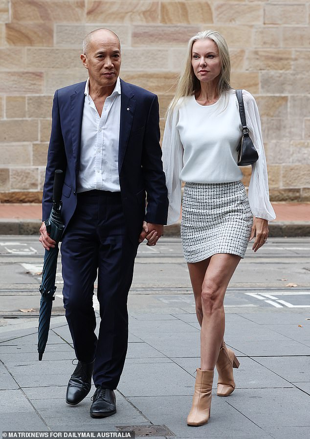 Dr.  Charlie Teo has made a 'significant' payout to a patient after controversial treatment for a malignant brain tumor (pictured with partner Traci Griffiths)