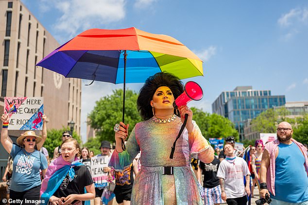 The LGBTQ community sees SB 12 as an attack on their existence.  People are pictured marching in Austin on April 15