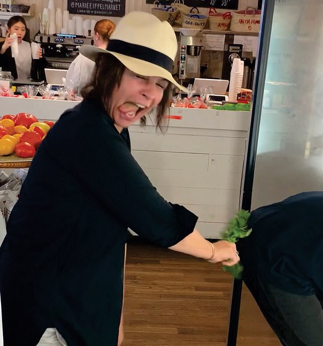 Marie Eiffel (pictured), the owner of a trendy New York café, has been charged with sexual harassment and assault against her employees in a lawsuit brought against her by eight foreign workers.  The suit includes this photo of Eiffel holding parsley to someone else's buttocks with her tongue sticking out