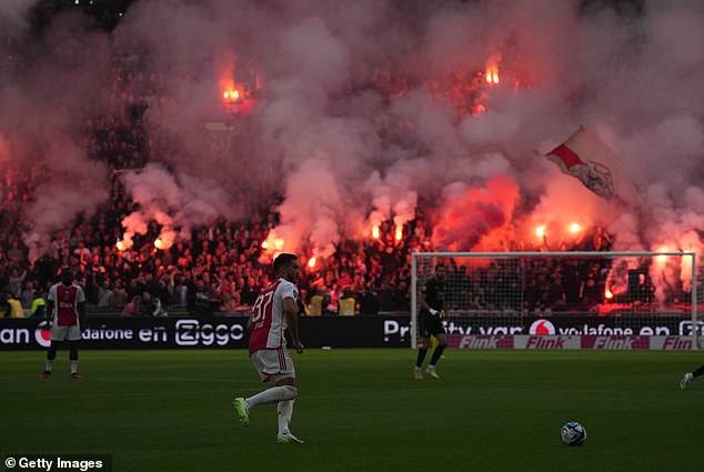 Sunday's match between Ajax and Feyenoord was abandoned after angry home fans threw flares and fireworks onto the pitch while their team was 3-0 down