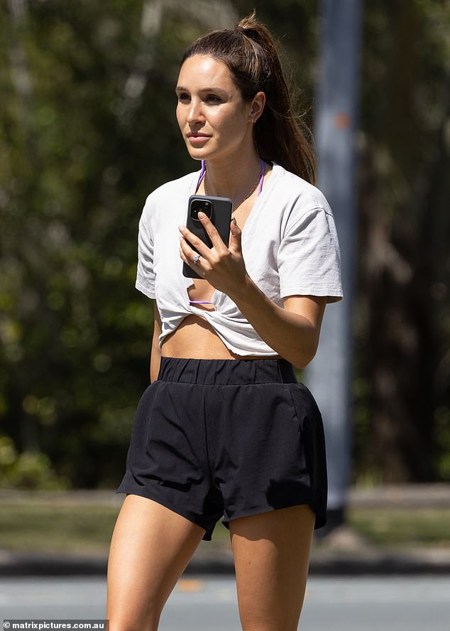 Kayla Itsines, 32, looked as fit as a fiddle as she stepped out in Noosa on the Sunshine Coast on Thursday