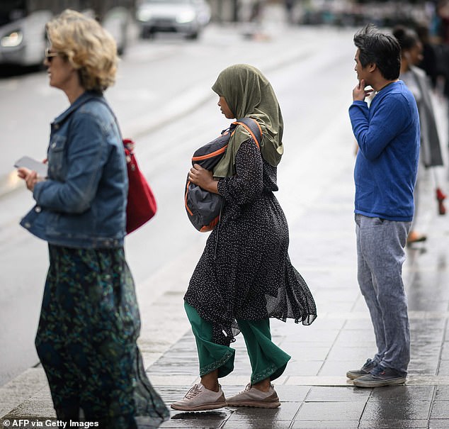 French schools sent dozens of girls home on the first day of the school year for refusing to take off their abayas — a shoulder-to-foot overgarment worn by Muslim women — a minister said on Tuesday.  Pictured: A woman wears an abaya in Nantes on August 31