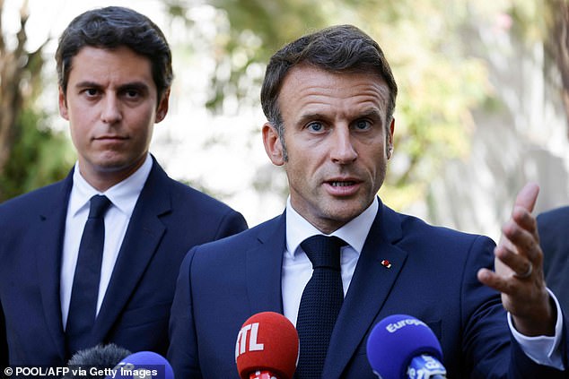 French Education Minister Gabriel Attal (pictured left with Macron on Sept. 1 in Orange, southeastern France) has banned the garment in schools and government buildings