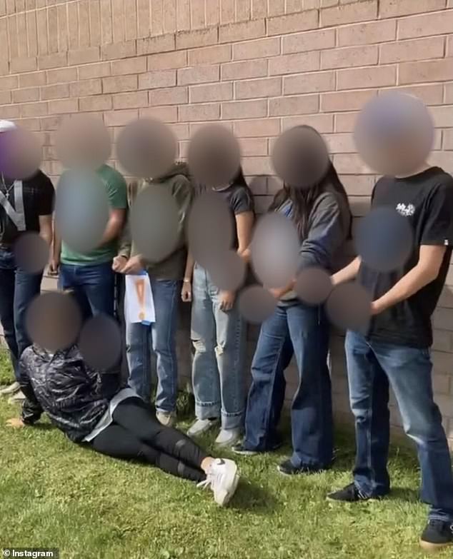 The now-deleted Instagram photo showed a mixed-race student lying on the ground as six others stood over her and shouted a racial slur with letters on their shirts