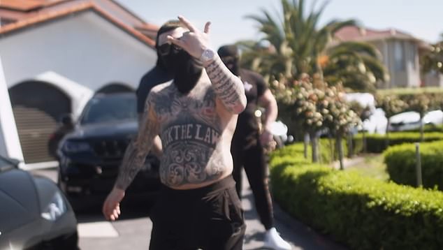 Jesse Marrogi in a rap video filmed outside his family's home