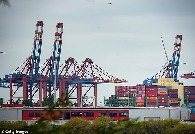 Breakdown: Shipping containers await transit at the Port of Hamburg, Germany.  Germany's Federal Statistical Office said exports fell 0.9% in July as global demand continued to falter