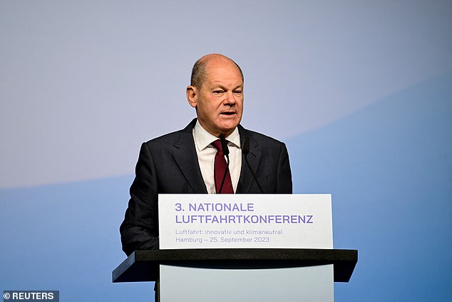 The 'gloomy' German economy is now 'treading water' after business morale deteriorated for the fifth month in a row, amid growing fears of a double-dip recession.  In the photo: German Chancellor Olaf Scholz gives a speech in Hamburg, September 25