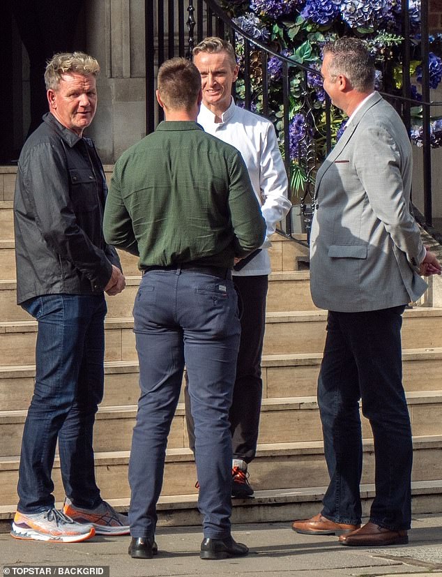 Fun times: Gordon Ramsay, 46, chatted with friends outside his Lucky Cat restaurant in London's Mayfair on Friday