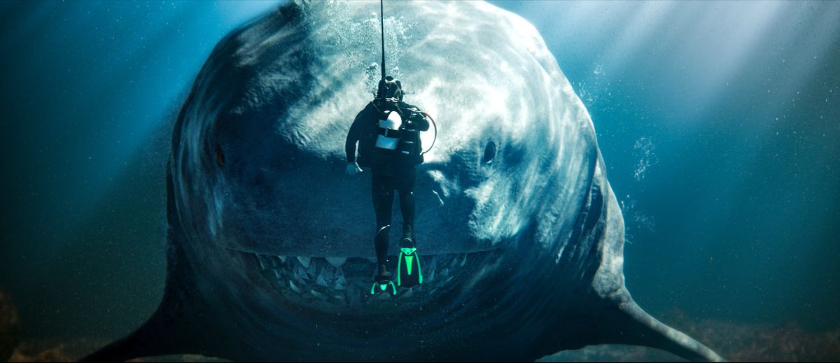 A diver comes face to face with a gigantic megalodon shark in Meg 2: The Trench.