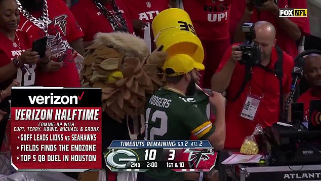 A Packers fan was celebrating his team's lead when the Falcons mascot objected