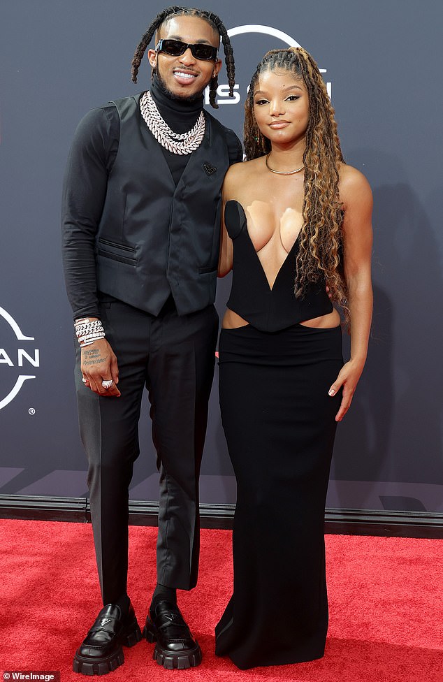 Dynamic duo: Halle Bailey has revealed that her romance with the rapper DDG is the 'first time' she's ever really been in love;  pictured in June 2022 at the BET Awards