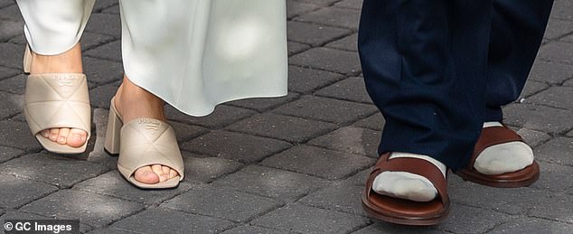 A big contrast: while Harper put on a pair of heels, David opted for socks and sandals