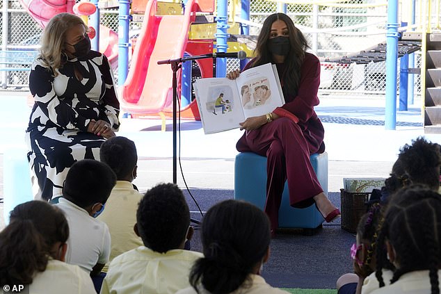 Meghan, 42, was dressed in a $5,000 suit and Cartier jewelry to read to second-grade students from her picture book The Bench, while Harry, 39, sat down with the kids