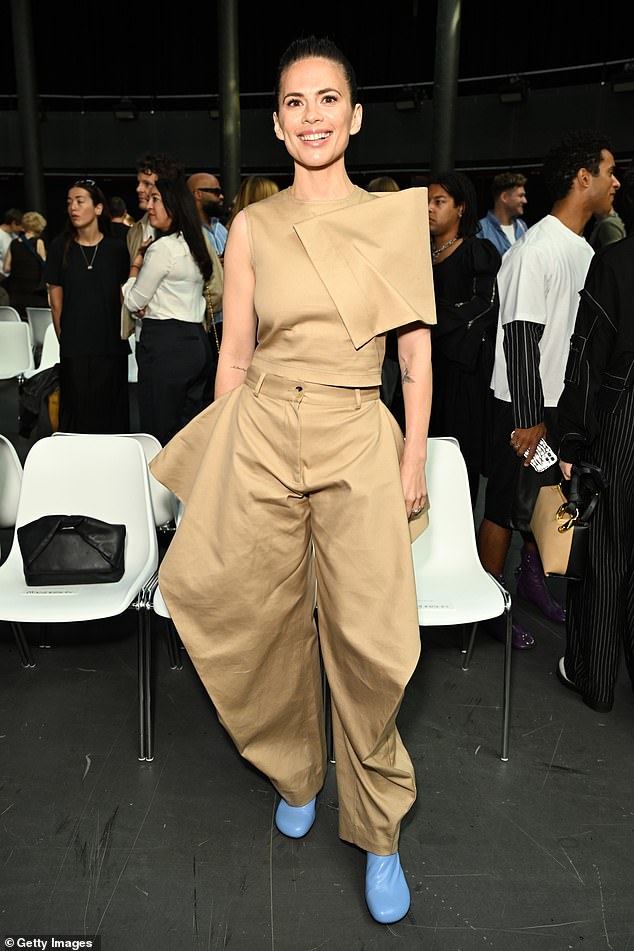 Gorgeous: Hayley, 41, looked effortlessly chic in a beige co-ord set which included a crew neck top with draped shoulder details