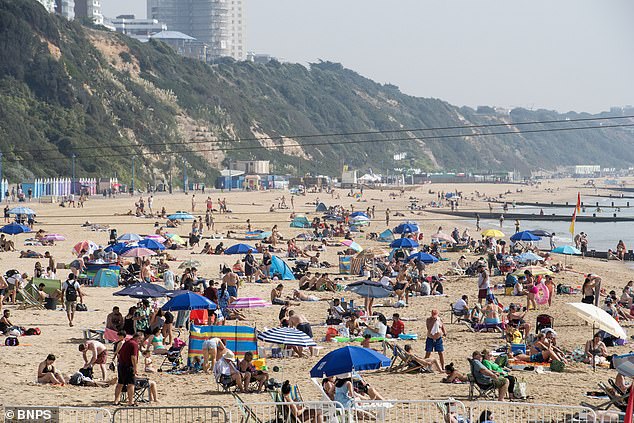 Britain could enjoy the hottest day of the year so far today as temperatures are expected to rise to 33 degrees Celsius after some areas endured an official heat wave for the first time since June.  But health experts fear that large parts of the population, especially the elderly and people with dementia, will be affected by heat-related illnesses, increasing demand for NHS services.  Pictured, another day with rising temperatures brings people to Bournemouth beach in Dorset today