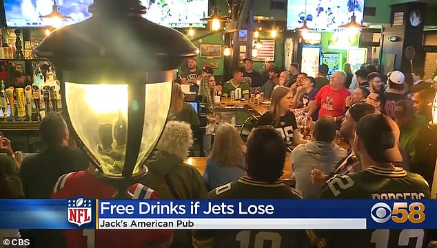 The crowd erupted in loud cheers hoping for free drinks after Aaron Rodgers went off injured just minutes into his Jets debut.