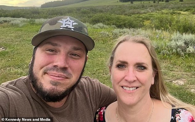 The restaurant owner and his partner Amanda Tolbert, 48, (pictured right) were boating along Montana's Bighorn River last month when they spotted a 20-inch brown trout.