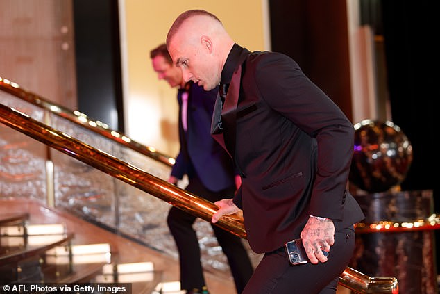 Martin was caught rushing into the Crown Palladium Ballroom through an alternate entrance to avoid media attention on the red carpet