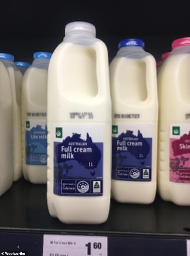 There's a big change coming to supermarket shelves: Woolworths is replacing the colored lids of its supermarket milk with clear lids (pictured)