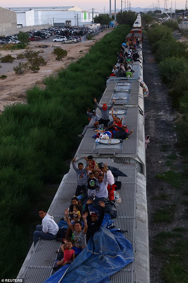 Dozens of migrants are pictured filling the freight train, dubbed 'The Beast', to the brim in August