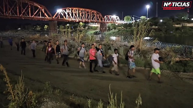 Shocking nighttime footage showed dozens of migrants pouring into Eagle Pass, Texas – a town of just 29,000 residents through which more than 11,500 refugees have flowed in the past 10 days.