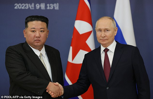 Russian President Vladimir Putin and North Korean leader Kim Jong Un shake hands during their meeting at the Vostochny Cosmodrome in the Amur region on September 13, 2023