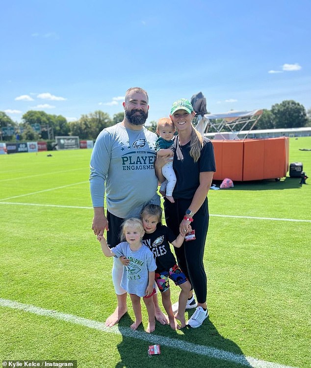 Family: Jason Kelce pictured with wife Kylie and their three daughters – Kylie said Travis is 'the absolute best uncle you could imagine'