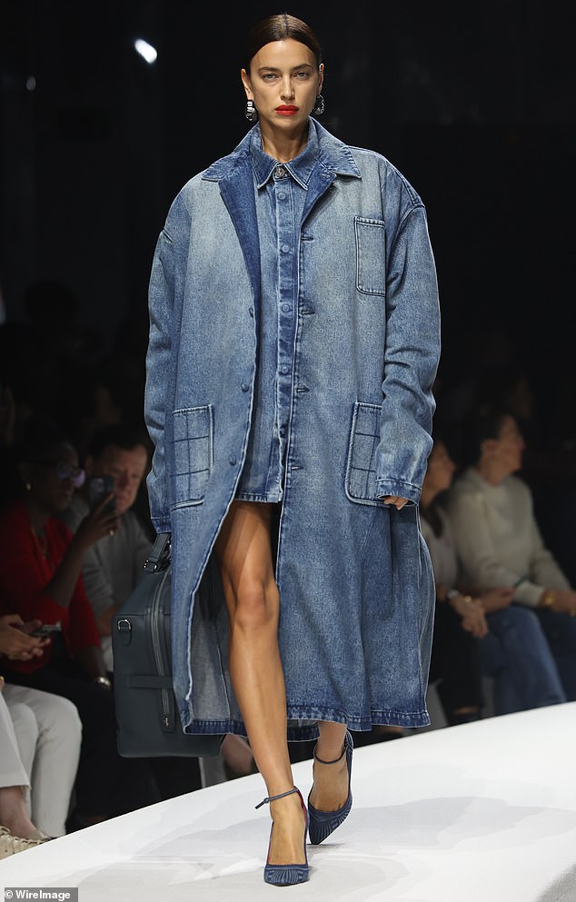 Fabulous: Irina Shayk, 37, made oversized denim look stylish as she led the models walking down the Ferrari catwalk during Milan Fashion Week in Italy on Saturday.