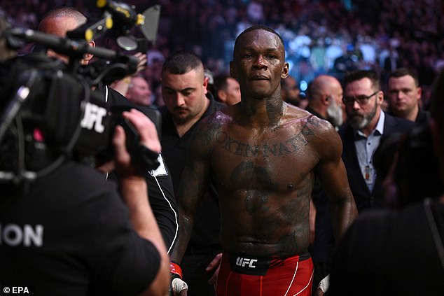 Nigeria's Israel Adesanya leaves the octagon after being defeated by Sean Strickland