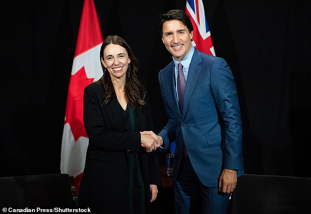 Shocking footage has captured the moment Jacinda Ardern (pictured, with Justin Trudeau) was harassed in the street after flying to Canada to attend a climate conference