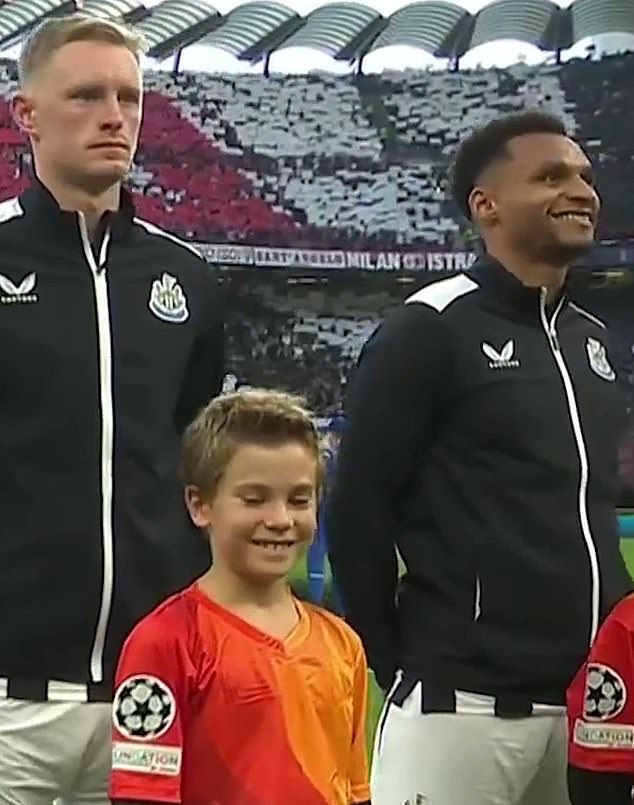 Jacob Murphy (right) was seen beaming as the Champions League anthem played at San Siro