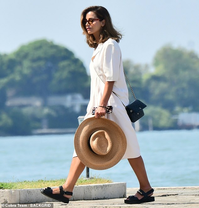 Chic: The actress, 37, showed off her trendy sense of style in a midi dress, wore black sandals and upped the ante with a Chanel crossbody bag