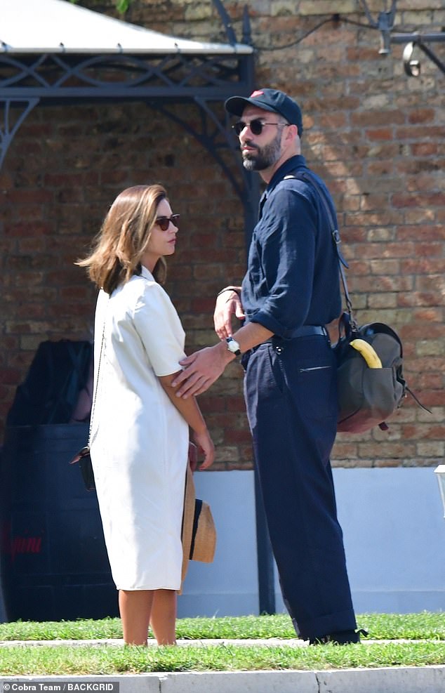 Cozy: Jenna Coleman looked chic in a white dress as she grabbed the PDA with her director boyfriend Jamie Childs in Venice on Sunday