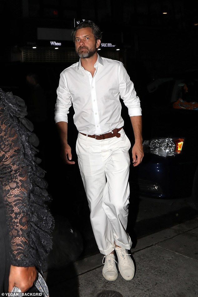 Smart: Meanwhile, the Dawson's Creek star looked dapper in a white open-collar shirt, which he teamed with matching trousers and trainers