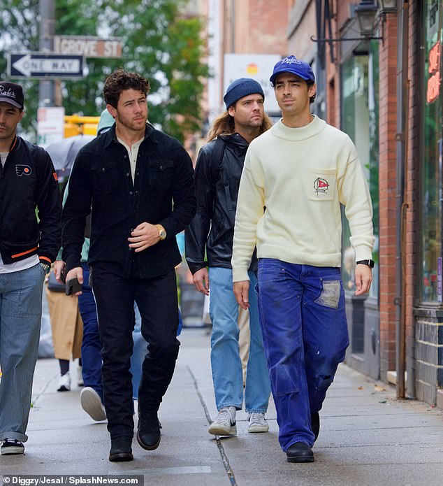 Brotherly love: Joe Jonas, 34, was spotted stepping out with brother Nick Jonas (L) in New York City on Monday