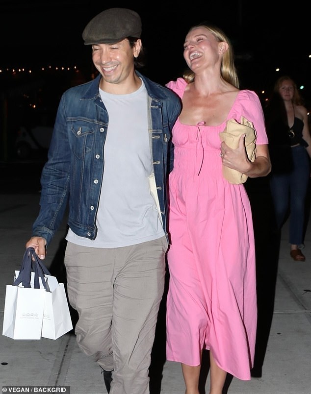 All dressed up: the actress, who previously opened up about her divorce, donned a bright pink dress with short sleeves as she stepped out with her husband