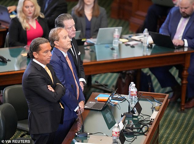 Attorney General Ken Paxton (center), with his attorneys Tony Buzbee and Dan Cogdell, plead not guilty in his impeachment trial on corruption-related charges in Austin, Texas