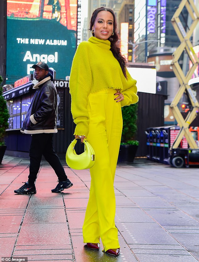 Big day: Kerry Washington, 46, brought her own personal sunshine to New York's rainy Times Square on Tuesday as she celebrated the release of her new memoir, Thicker Than Water