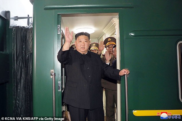 Kim Jong-un waved as he left Pyongyang by train for a visit to Russia on Sunday