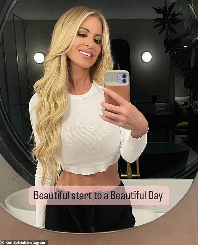 Slim: Kim Zolciak showed off her fantastic figure in a new selfie shared to Instagram on Wednesday morning, saying she had a 'beautiful day'