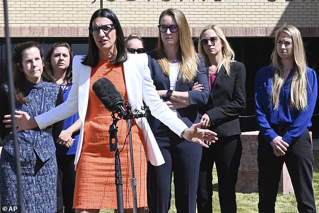 Barry Morphew's lawyer Iris Eytan is pictured with the legal team in April 2022 when charges against him were dropped