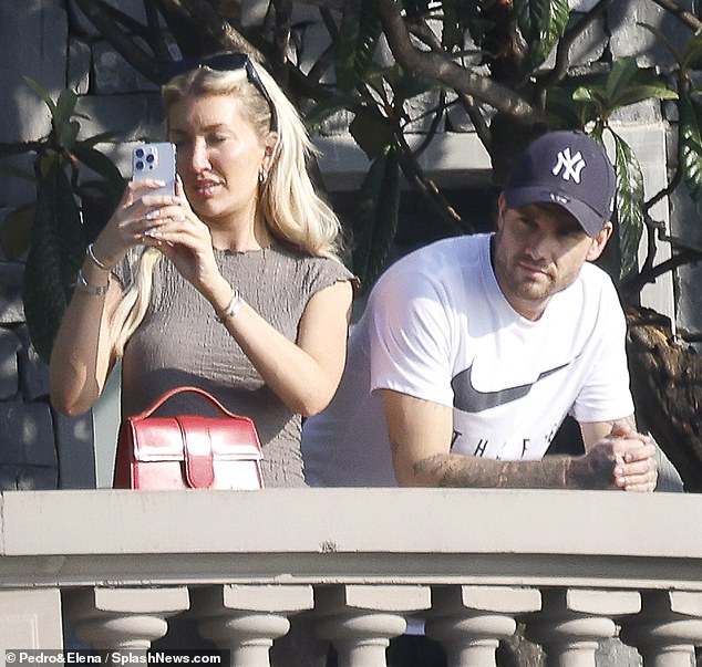 Hospital: Liam, pictured in Lake Como on Saturday with girlfriend Kate Cassidy, before being rushed to hospital