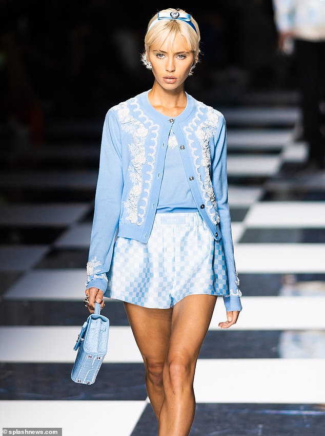 Dressed in a baby blue Versace outfit, Iris Law, 22, pictured walking the Versace catwalk during Milan Fashion Week