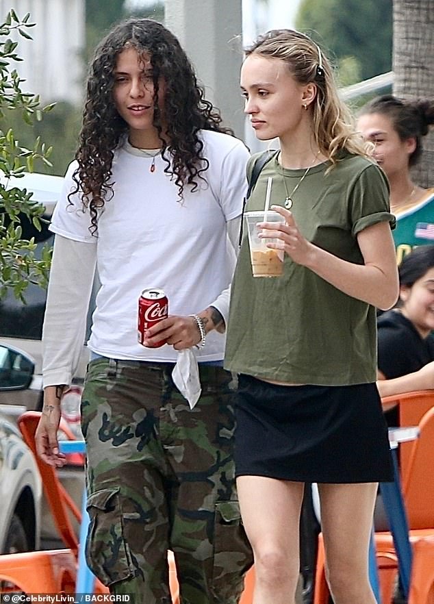 Happy couple: Lily-Rose Depp showed off her impressively toned legs in a black miniskirt on a coffee date with her friend 070 Shake in Los Angeles, California