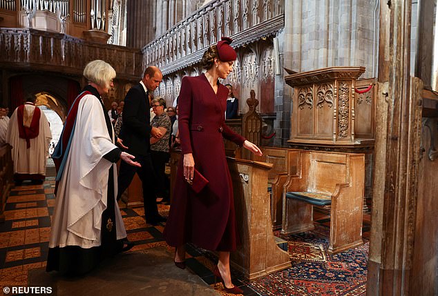 William and Kate are escorted to their seats by Sarah Rowland Jones, Dean of St David's Cathedral, as they attend the service