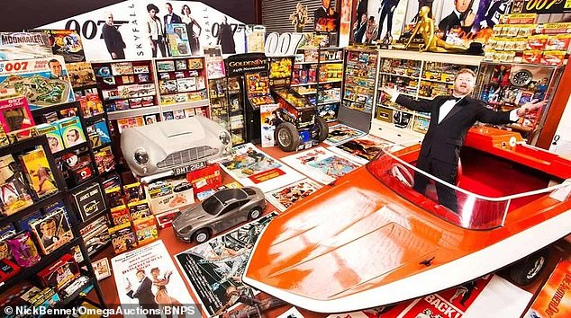 Nick Bennett, 57, (pictured) holds the Guinness world record for the world's largest James Bond collection