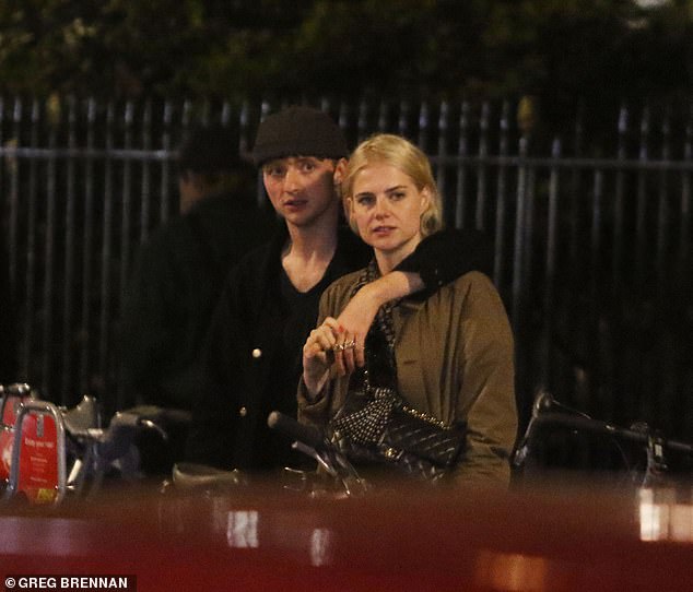 Ahead: Lucy Boynton, 29, was spotted cozying up to guitarist Murdo Mitchell as the pair enjoyed a date night in London on Thursday evening following her split from Rami Malek, 42